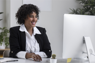 business manager in their office smiling 